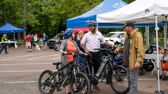 Eventgoers testing out e-bikes at EnviroFest