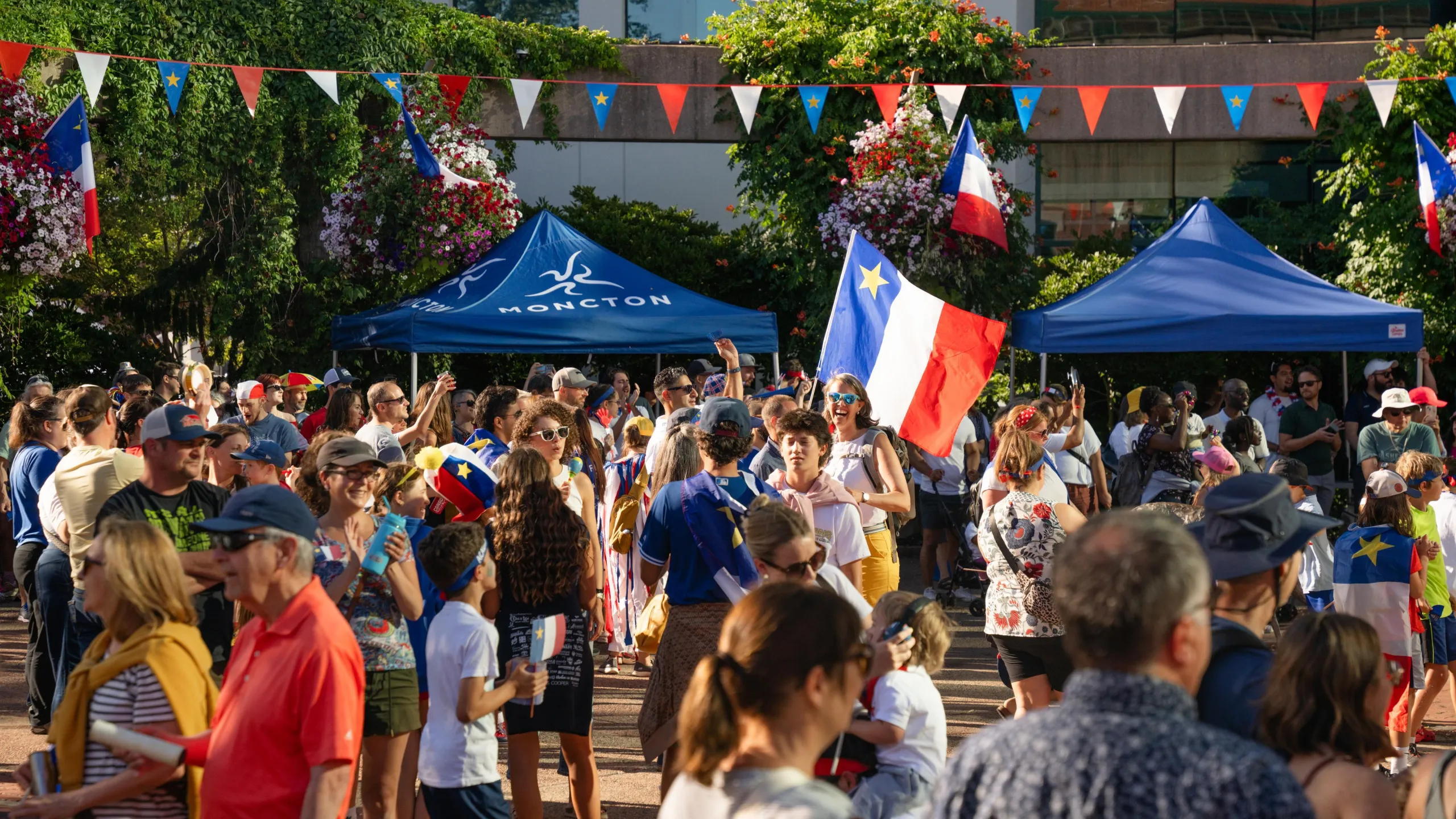 Crowd in front of Moncton City Hall for National Acadian Day