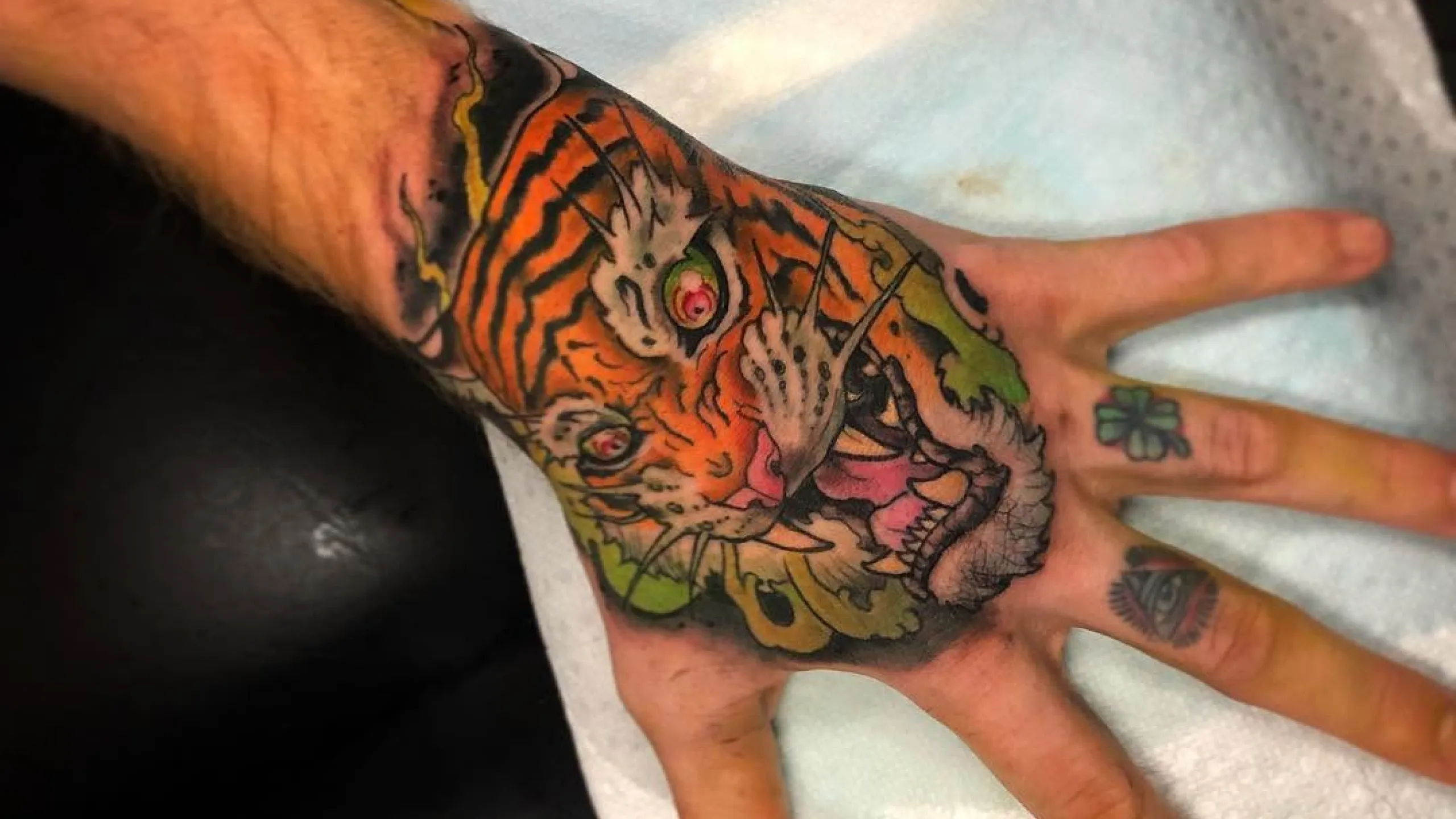 Hand with tiger tattoo
