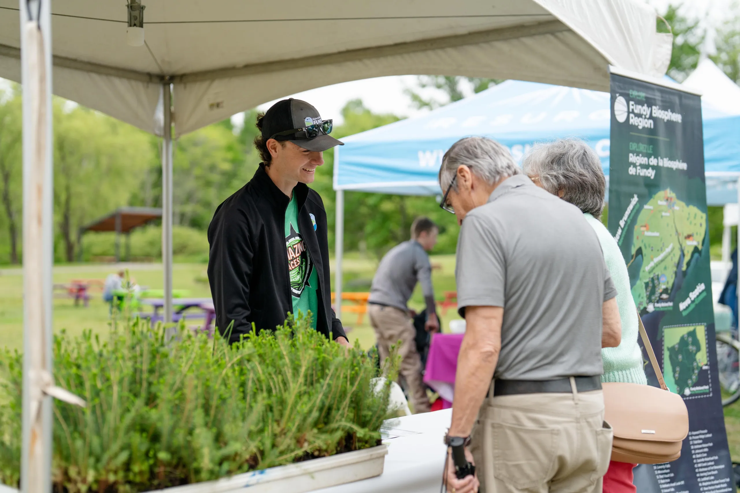 Senior couple talking to a vendor at EnviroFest